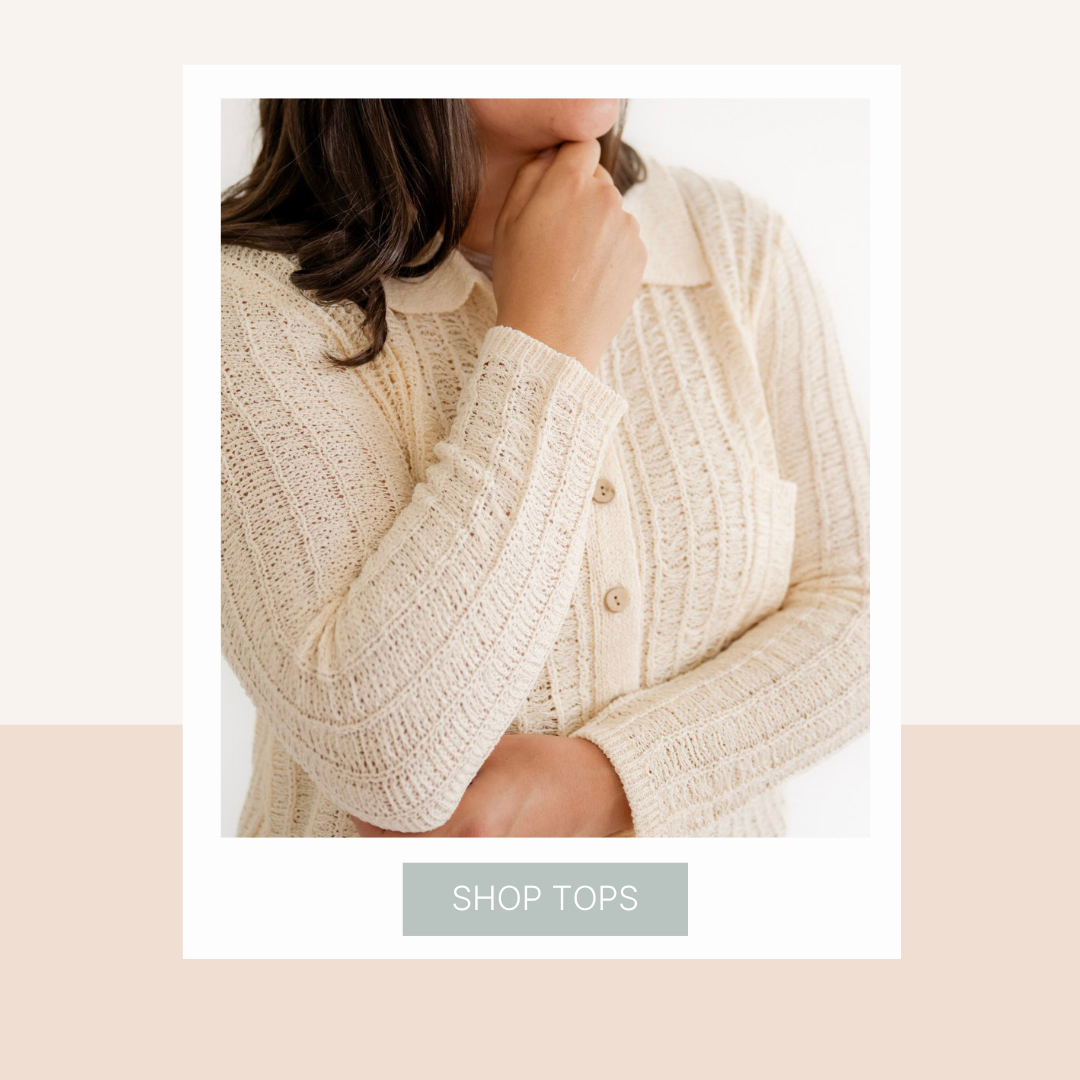 Close-up of a woman wearing a cream-colored textured sweater with a 'Shop Tops' button below.
