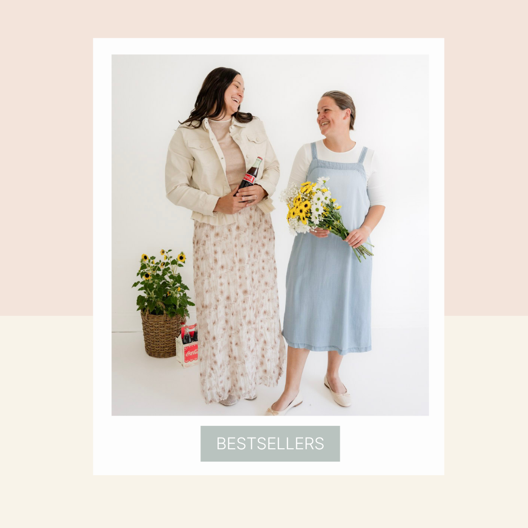 Two women standing together, one holding a bottle and the other with flowers, on a light background with 'BESTSELLERS' label.
