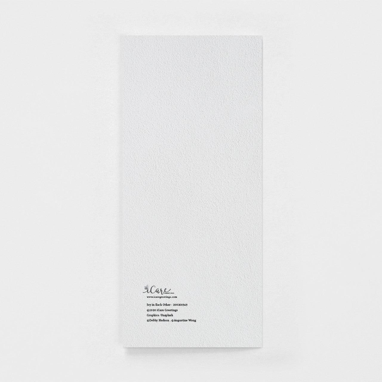 Back of a Joy in Each Other wedding greeting card on white background, Salt and Honey boutique.