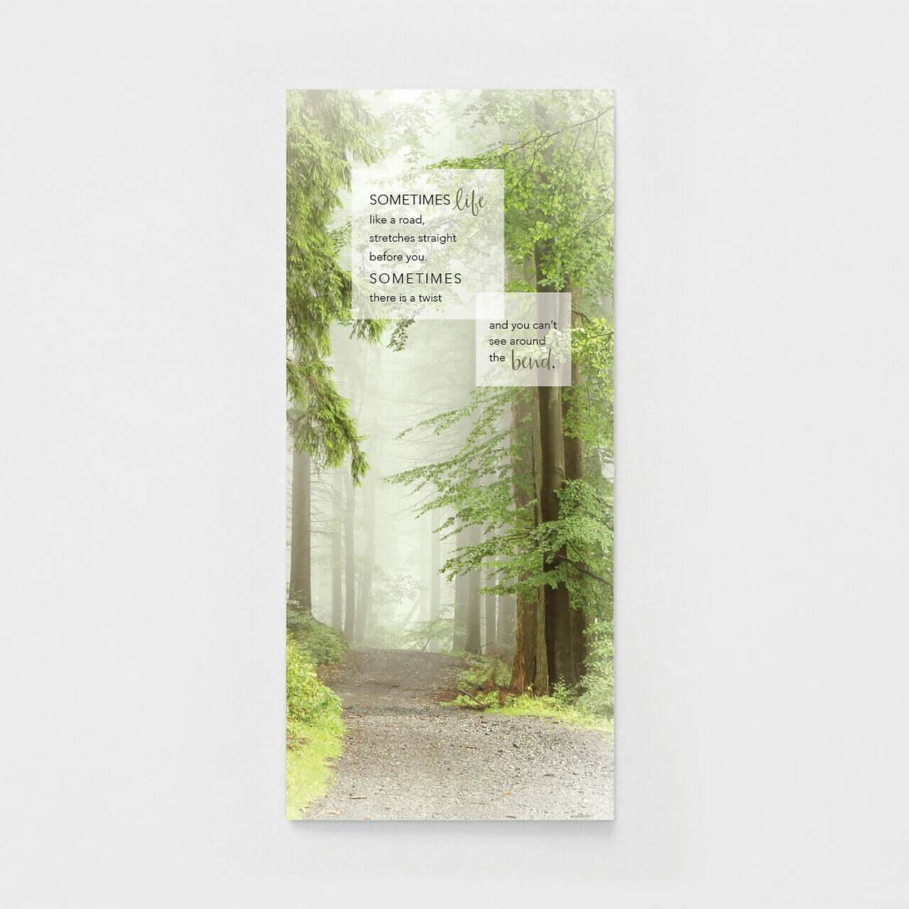 Inspirational card with misty forest path, green trees, and motivational quote about life twists