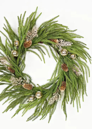 Green wreath with gold balls and pinecones on a white background