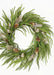 Green wreath with gold balls and pinecones on a white background