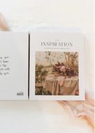 Two white art prints or cards laid side by side on a soft white surface with pale pink fabric accents. The left print has black handwritten-style text reading, 'Because you love me when I am mad, my heart will thank you.