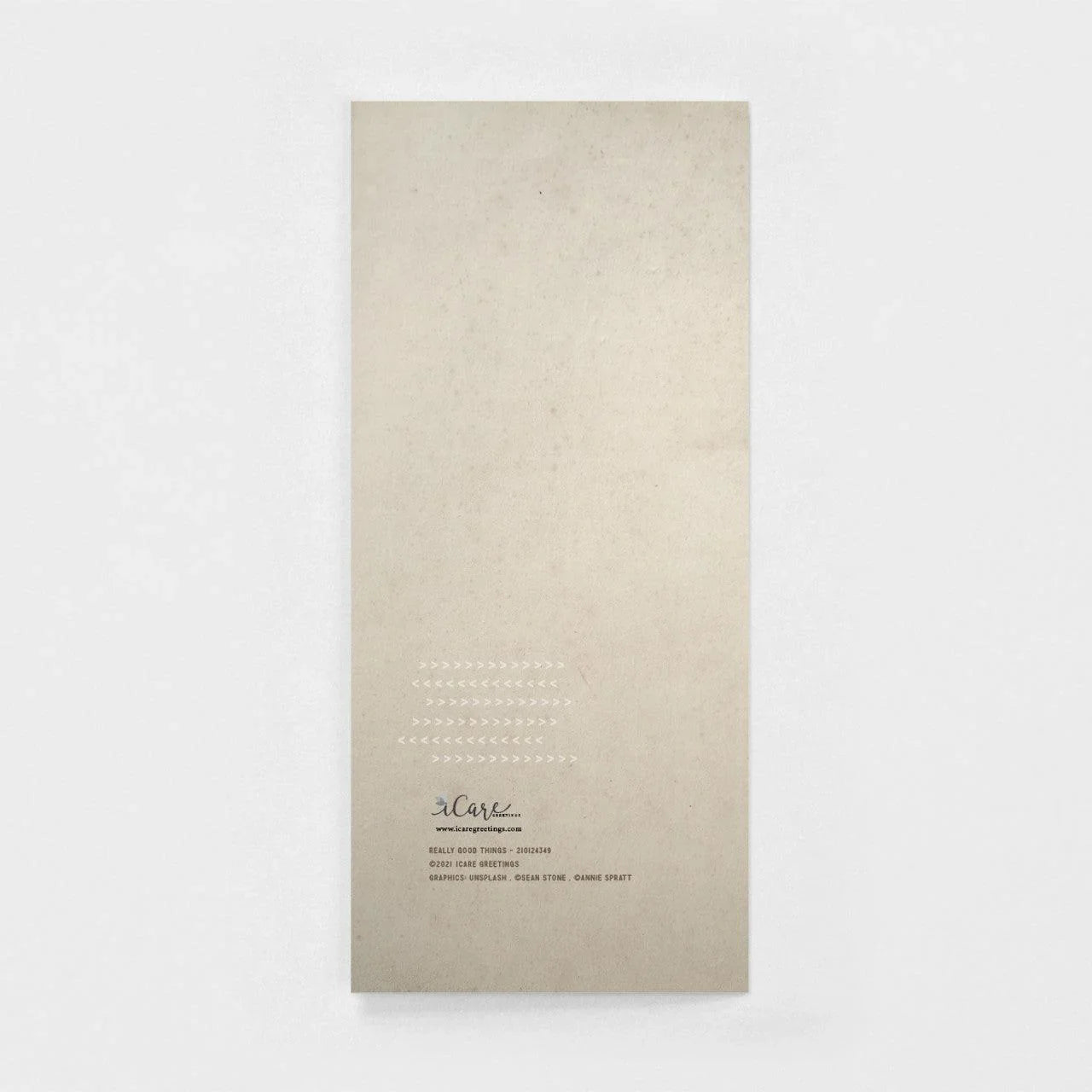 Back of a minimalist masculine birthday greeting card on neutral background