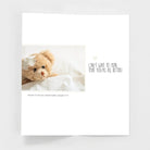 Get well greeting card with a plush teddy bear with bandage and encouraging message inside
