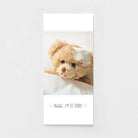 Get well soon greeting card with a cute teddy bear in bed and a bandage on its head