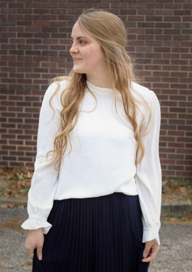 modest long sleeve mock neck ruffle top in ivory white